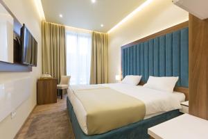 Postel nebo postele na pokoji v ubytování Marquise Hotel Garni