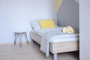 a bedroom with a bed and a dresser at Hostel Bratislava in Bratislava