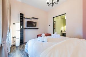 Postel nebo postele na pokoji v ubytování Athens Mini Suite