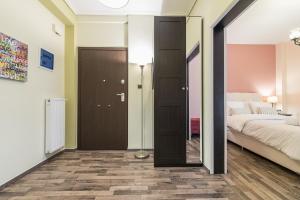 Postel nebo postele na pokoji v ubytování Athens Mini Suite