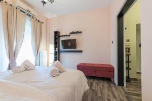 Postel nebo postele na pokoji v ubytování Athens Mini Suite