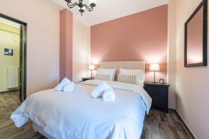 Postel nebo postele na pokoji v ubytování Athens Mini Suite