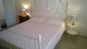 En eller flere senge i et værelse på Trullo saraceno