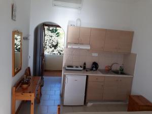 a kitchen with a sink and a counter top at Zefyros Studios in Damnoni