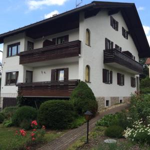 a large white building with windows and a balcony at Haus Liesal in Spiegelau