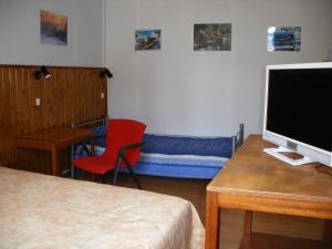 Postel nebo postele na pokoji v ubytování Hôtel Modern