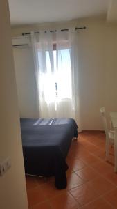 Postel nebo postele na pokoji v ubytování Casa Falcone B&B