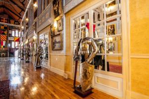 a store with a statue in the middle of a hallway at Amsterdam Castle NY in Amsterdam