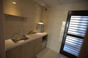 Koupelna v ubytování Mayu Hotel + 37 fotografií