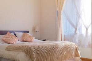 Cama ou camas em um quarto em Hotel San Fernando