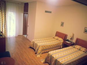 Un ou plusieurs lits dans un hébergement de l'établissement Natassa Hotel