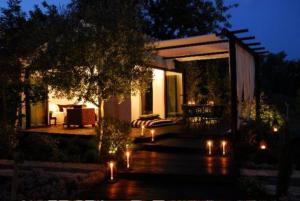 a house with lights in front of it at night at Quinta da Lua in Tavira