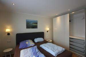 Postel nebo postele na pokoji v ubytování Ferienwohnung in Warnemünde, Friedrich-Franz-Straße 11