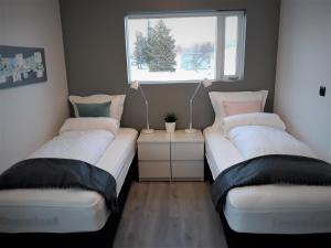 Ένα ή περισσότερα κρεβάτια σε δωμάτιο στο Post-Plaza Guesthouse