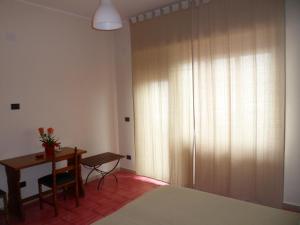 Łóżko lub łóżka w pokoju w obiekcie Hotel Panorama di Sicilia