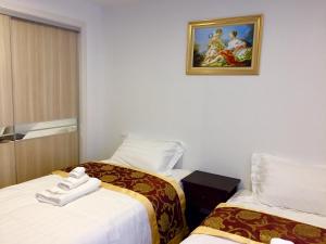 Katil atau katil-katil dalam bilik di Amber Homes B