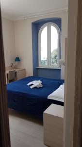 Cecio 5 Terre Rooms tesisinde bir odada yatak veya yataklar