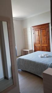Cecio 5 Terre Rooms tesisinde bir odada yatak veya yataklar