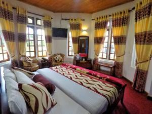 Giường trong phòng chung tại Nuwara Eliya Hills Rest