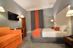 Voodi või voodid majutusasutuse Hotel Montecarlo toas