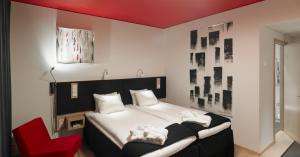 Postel nebo postele na pokoji v ubytování Kosta Boda Art Hotel + 23 fotografií