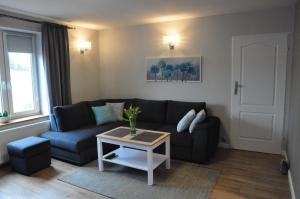 Część wypoczynkowa w obiekcie Apartament w lesie