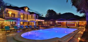 a large swimming pool in front of a house at B&B Boutique Hotel in Dalyan