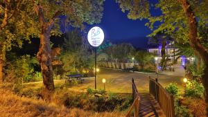 a sign in the middle of a park at night at B&B Boutique Hotel in Dalyan