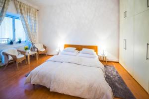 
Postel nebo postele na pokoji v ubytování Renesanční vinařský dům v historickém centru Znojma
