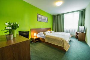 Posteľ alebo postele v izbe v ubytovaní Hotel Slovan