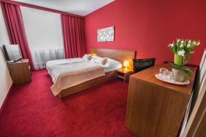 Posteľ alebo postele v izbe v ubytovaní Hotel Slovan