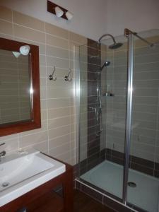 a bathroom with a shower and a sink at DOMAINE D'ENTUDELLE in Lussan