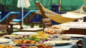a table topped with plates of food on a table at B&B Boutique Hotel in Dalyan