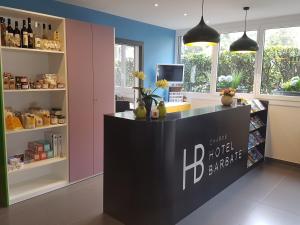 a bar in a store with bottles of wine at Charme Hotel Barbatè in Tegna