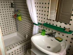 a bathroom with a sink and a toilet and a mirror at L'eau Bourde in Gradignan +20 photos