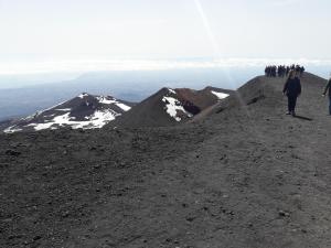 a group of people walking on top of a mountain at Casa Holiday Sea Etna Di Enza in Linguaglossa