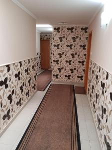 Voodi või voodid majutusasutuse Guest house Mali hotel toas