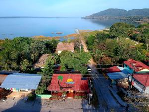 an overhead view of a village with a lake at Sun Breeze Hotel in El Remate