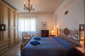 מיטה או מיטות בחדר ב-Casa Murazzi