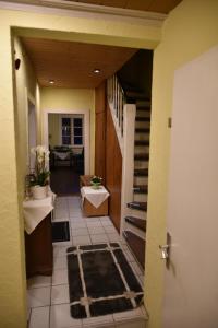 a hallway of a house with a staircase and a room at Ferienwohnung Domäne Süpplingenburg in Süpplingenburg +25 photos