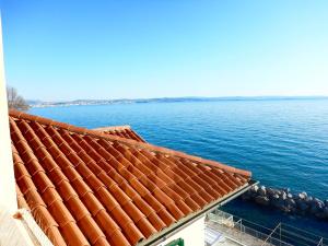 a view of the ocean from a roof of a building at Villa Tergeste in Trieste
