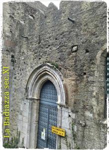a stone building with a large window on it at La Badia in Messina
