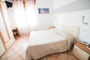 Postel nebo postele na pokoji v ubytování Hotel da Renato