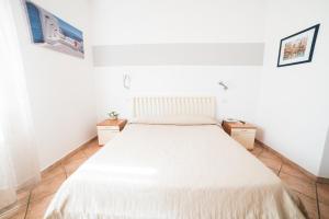 Postel nebo postele na pokoji v ubytování Hotel da Renato
