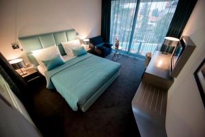Кровать или кровати в номере Hotel Arupinum