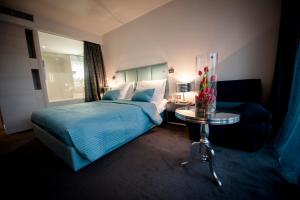 Кровать или кровати в номере Hotel Arupinum