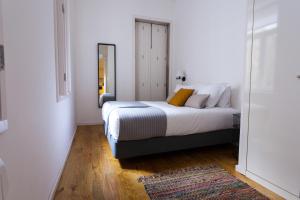Llit o llits en una habitació de Oporto City View - Santa Catarina
