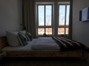 En eller flere senge i et værelse på Ferien Apartment