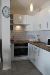 Kuchyň nebo kuchyňský kout v ubytování Apartament "Zacisze"