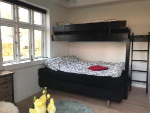 a bedroom with two bunk beds in a room at Revninge Guesthouse in Revninge